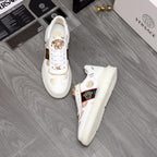 Versace white sneakers with gold crest detail and logo stripe on chunky sole