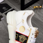 Versace white high-sole sneakers with gold crest lace hardware and logo accent
