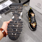 Thick black sneaker outsole with deep tread, paired with black upper and checker laces