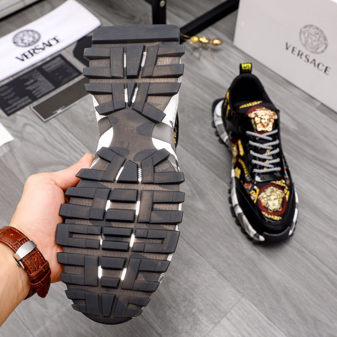 Thick black sneaker outsole with deep tread, paired with black upper and checker laces