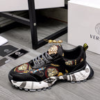 Black lace-up sneakers with baroque graphic panel, gold crest details, chunky tread sole