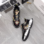 Pair of black Versace sneakers with baroque medallion accents and checker lace-up design