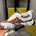 Burberry lace-up sneakers with white leather and brown-red check design, chunky sole