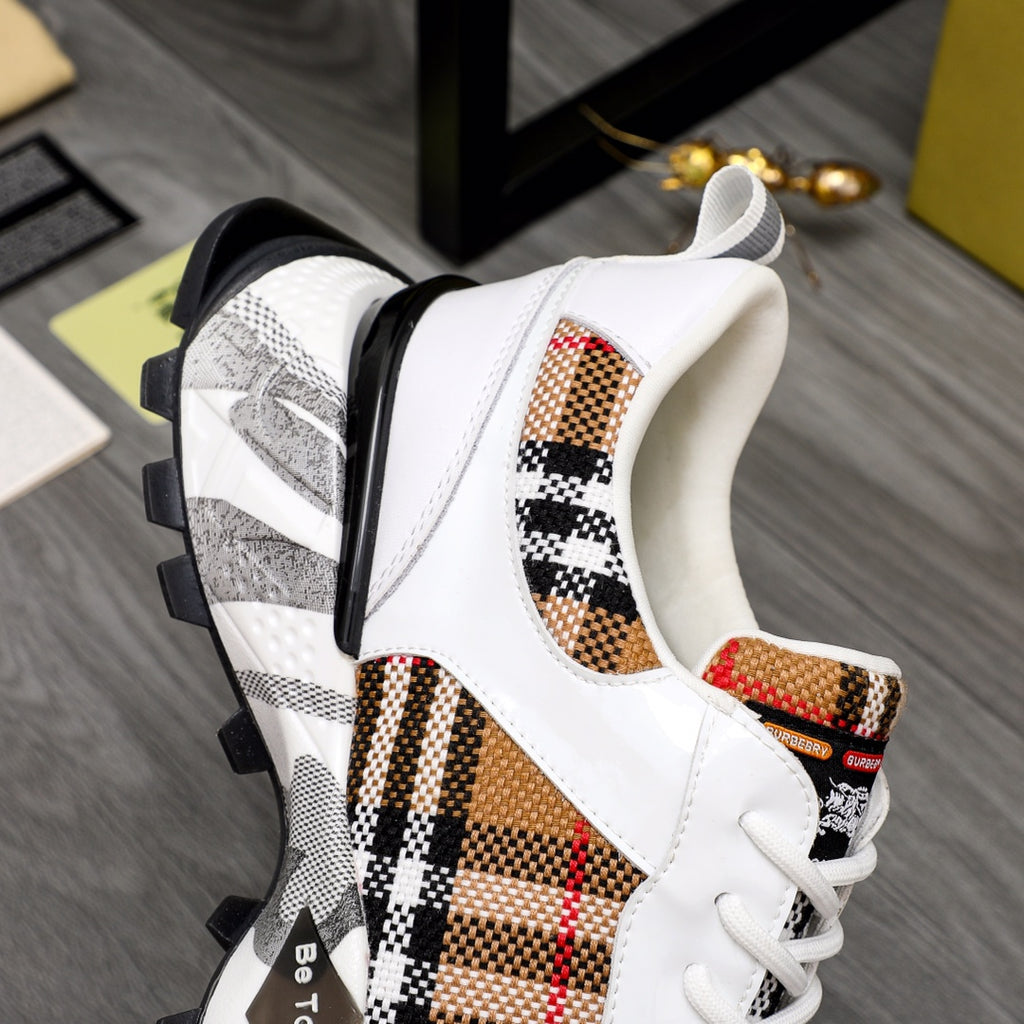 Burberry sneaker side view: white leather with check inserts and chunky sole