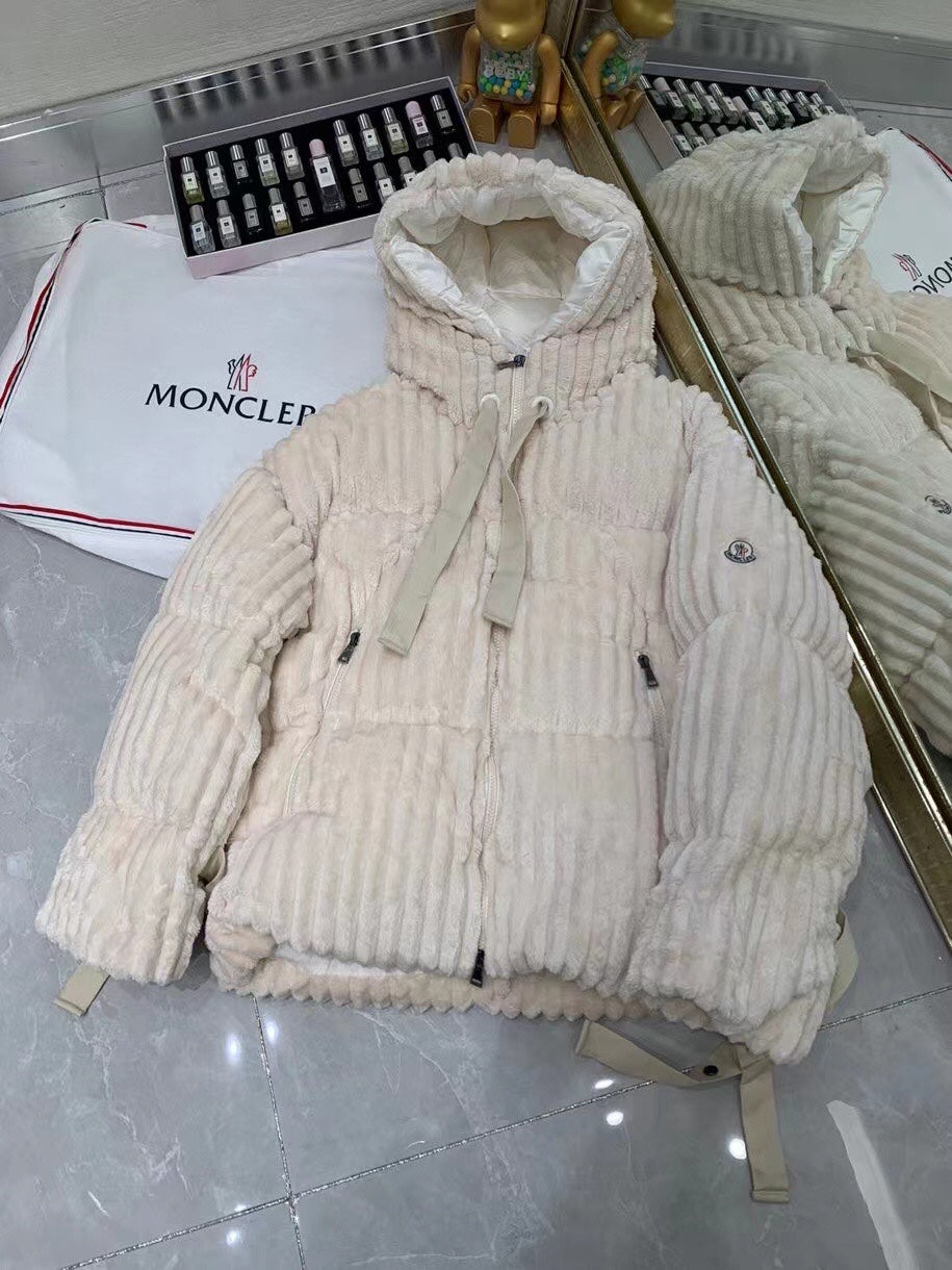 Cream long puffer jacket with hood, zipper front, and corded pull tabs