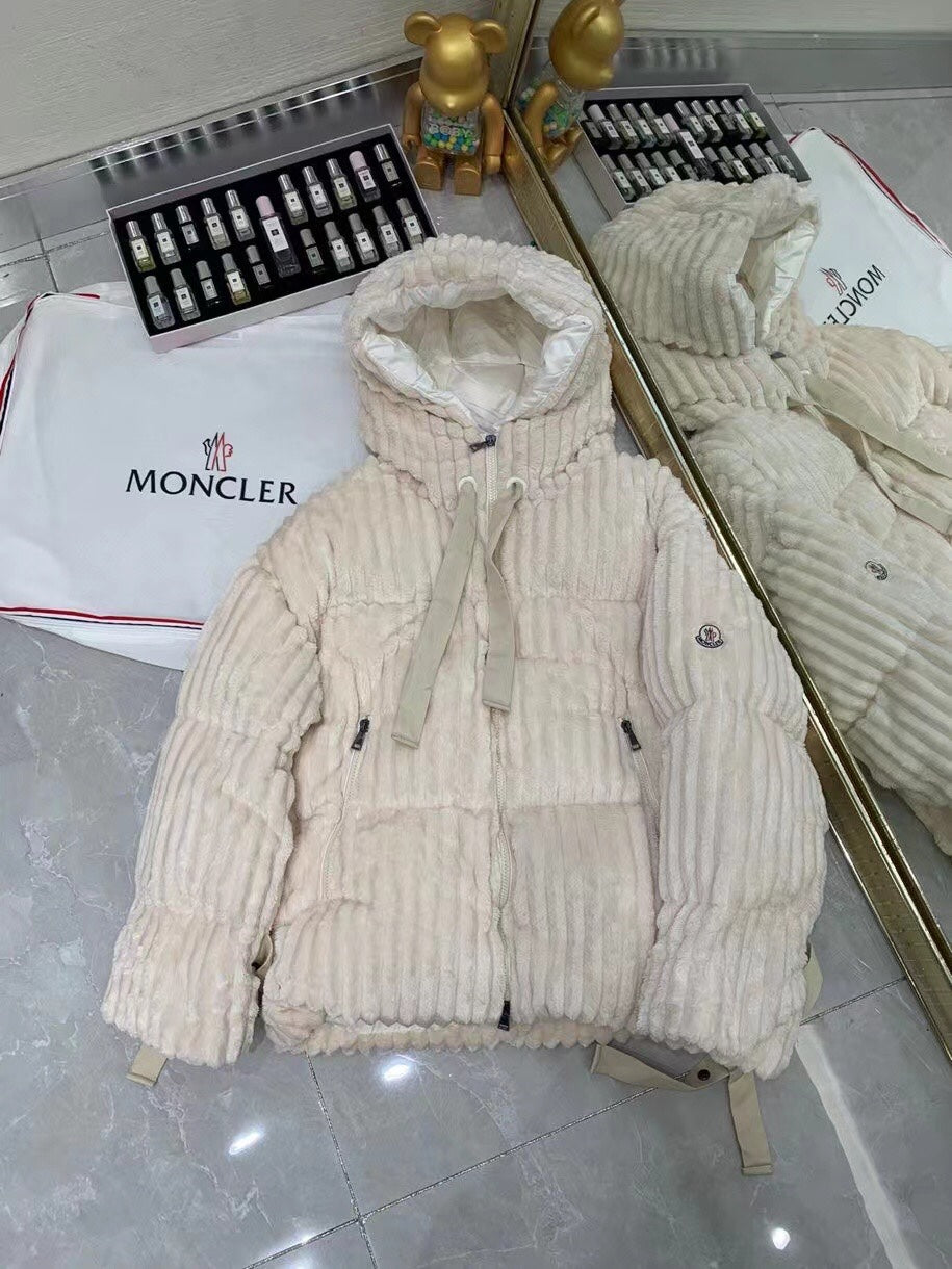 Cream hooded long puffer jacket with front zipper and small chest emblem
