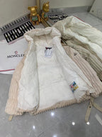 Cream hooded puffer jacket laid flat, showing front zipper and side pockets