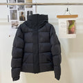 Black long puffer jacket with hood, front zipper and quilted paneling
