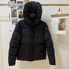 Black long puffer jacket with hood up and front zipper
