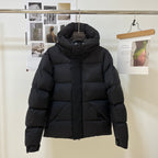 Black long puffer jacket with raised hood and front zipper