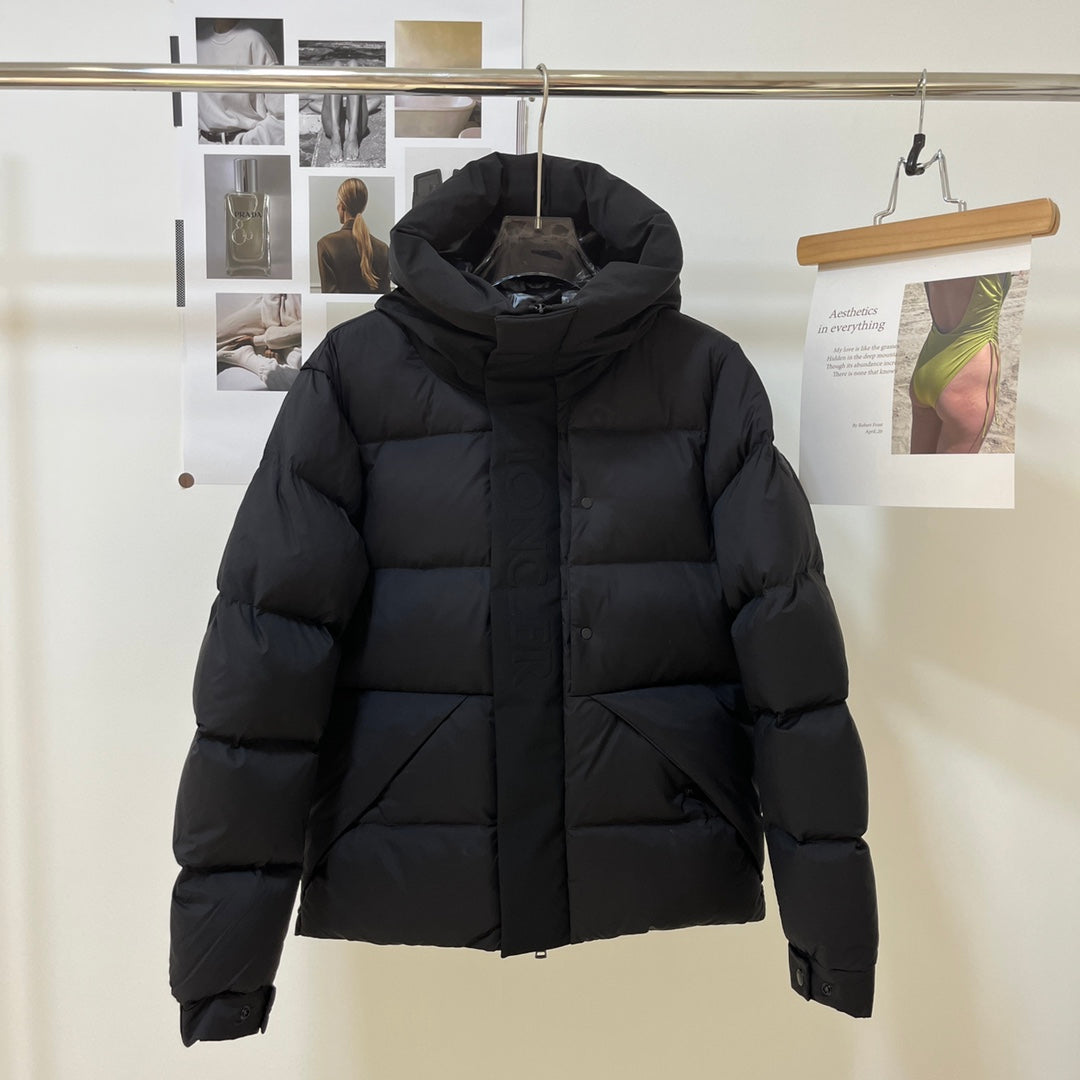 Black long puffer jacket with raised hood and front zipper