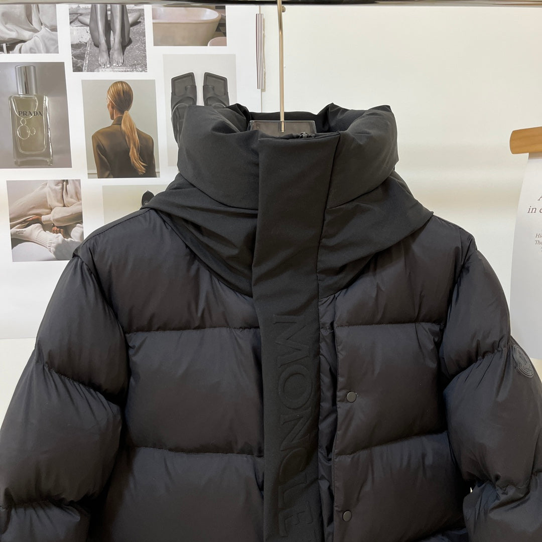 Black long puffer jacket hood with front buttons and quilted padding