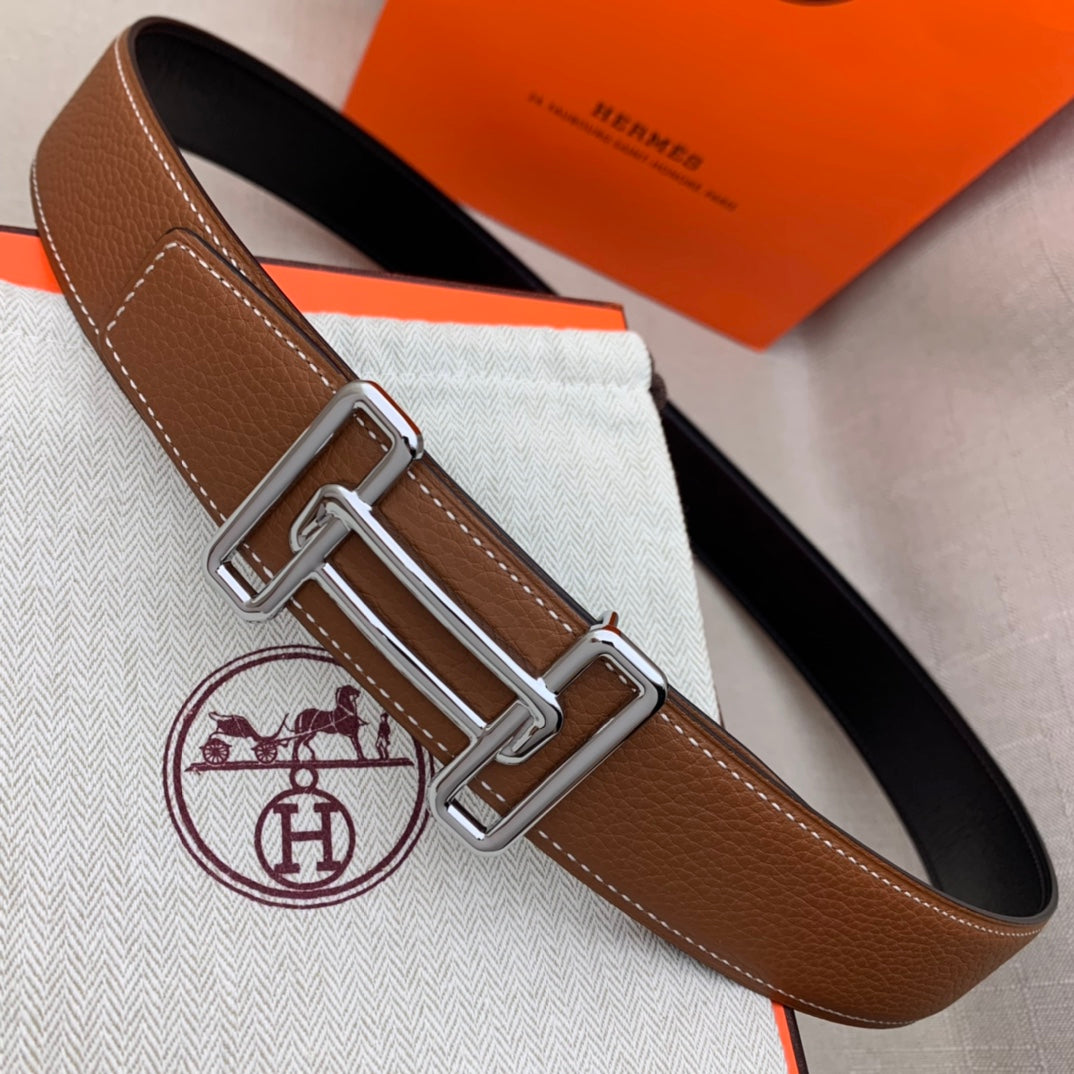 Brown leather belt with silver-tone double H buckle and white contrast stitching.
