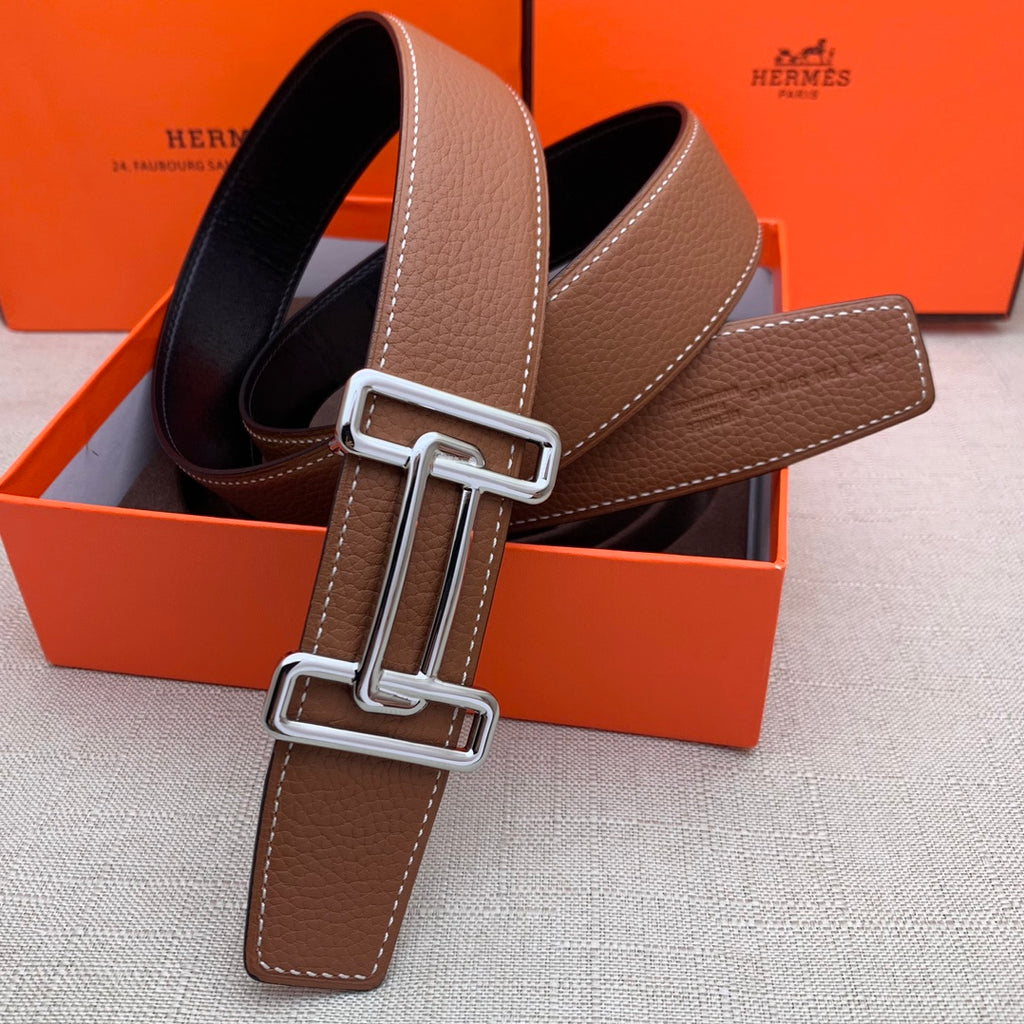 Brown leather belt with silver-tone double H buckle and stitched leather end tab.