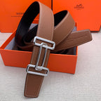 Brown leather belt with silver-tone double H buckle and stitched leather end tab.