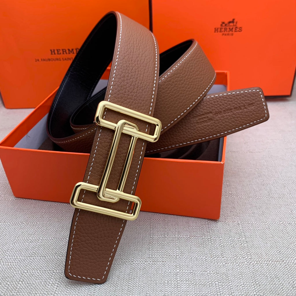 Brown leather belt with gold-tone double H buckle and stitched leather end tab.