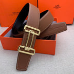 Brown leather belt with gold-tone double H buckle and stitched leather end tab.