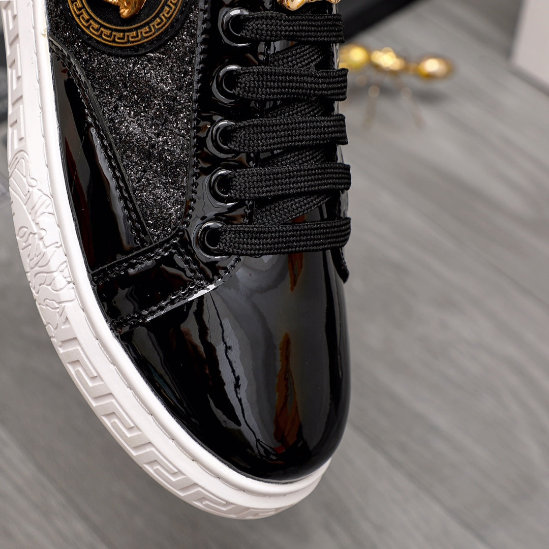 Versace black sneakers close-up of black laces and gold medallion on side