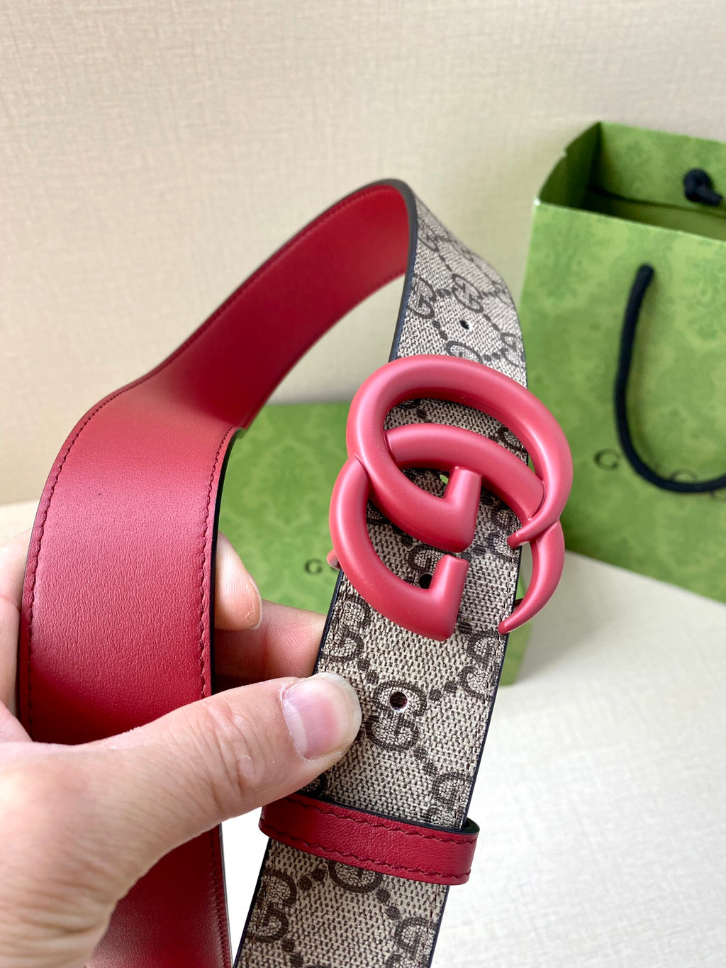 GG monogram belt strap with red leather and pink double-G buckle