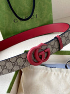 GG monogram belt with red leather and pink double-G buckle close-up