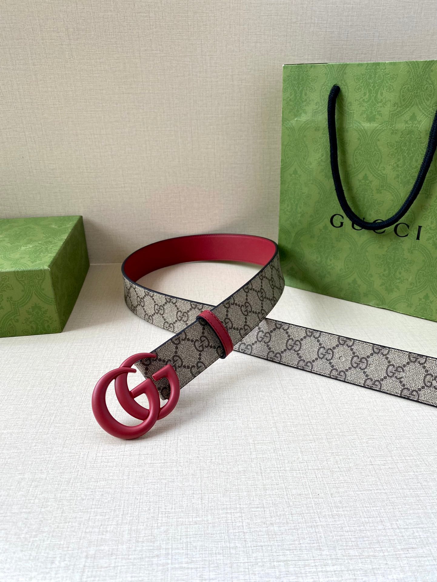 GG monogram belt with red leather and pink double-G ring buckle