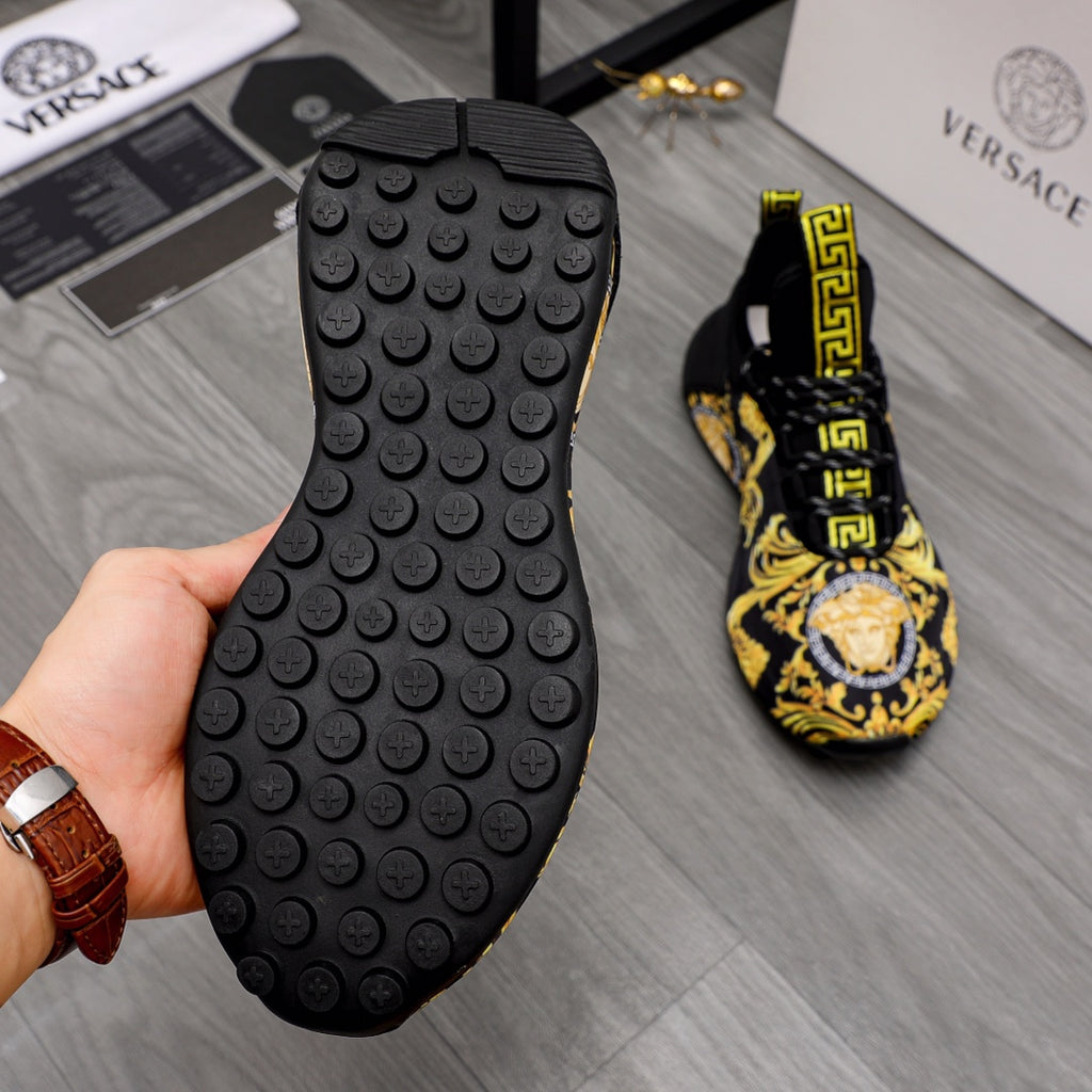 Black rubber outsole of luxury sneakers with round traction nubs, underside view