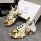 Versace lace-up sneakers in white with gold baroque print and Greek key heel tabs