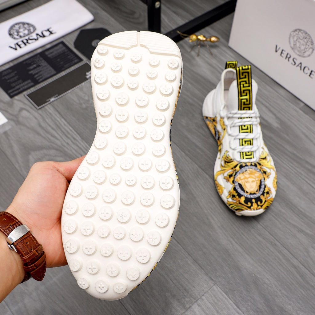 Versace sneakers outsole view: white textured rubber tread with circular grip studs