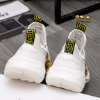 Versace sneakers back view: white cushioned heels with gold baroque accents and thick soles