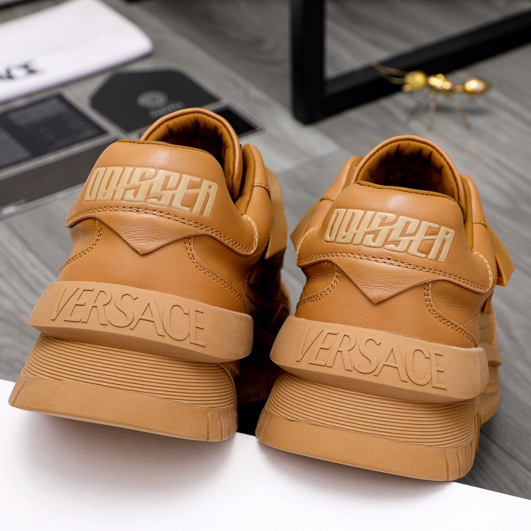 Luxury shoes: tan sneakers from back showing raised logo and cushioned heel collar