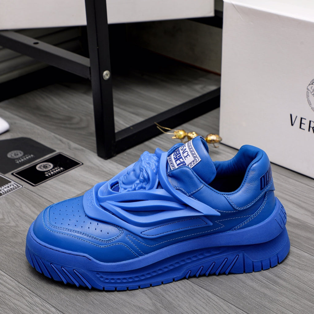 Blue Versace luxury sneakers, side view with chunky tread sole