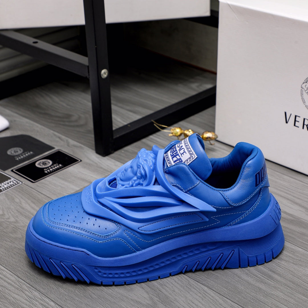 Blue Versace luxury sneakers, side view with chunky tread sole