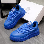 Blue Versace luxury sneakers with lace-up front and textured sole