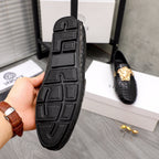 Versace black loafer sole with patterned tread and heel grip texture