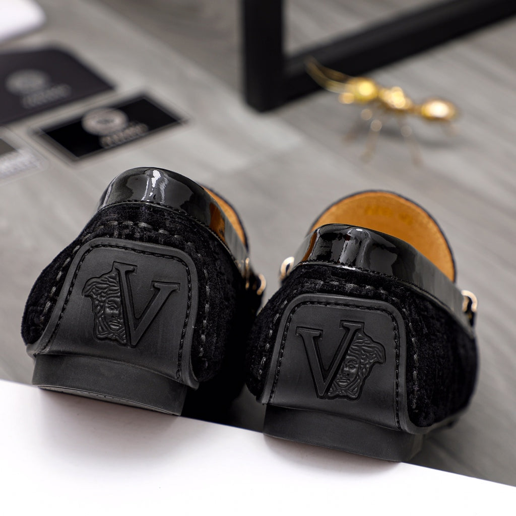 Versace black loafers with embossed logo at heel and glossy cap-toe