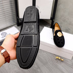 Versace black loafer outsole with textured tread and embossed logo panel