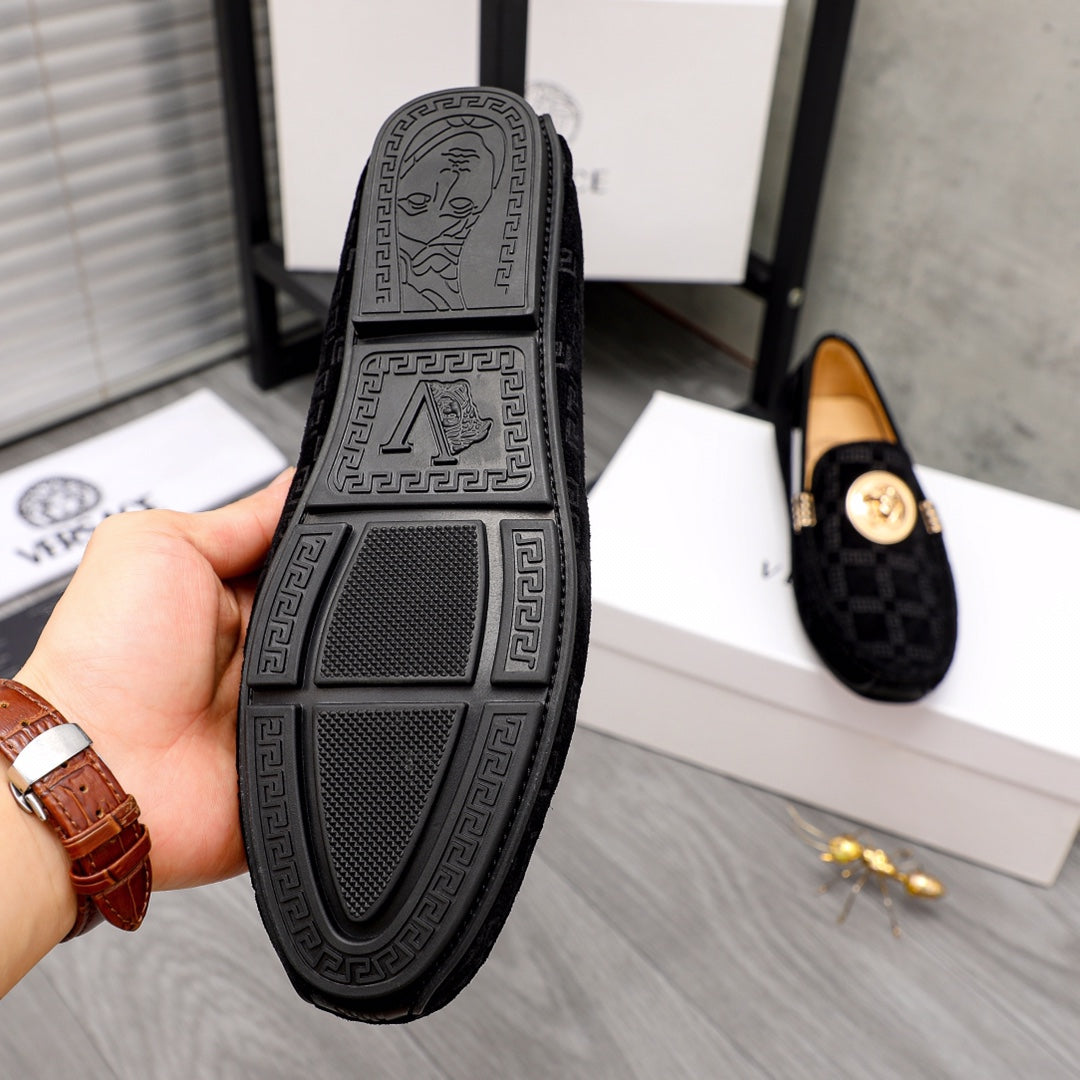 Versace black loafer outsole with textured tread and embossed logo panel