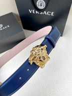 Blue leather belt with ornate gold Medusa buckle and stitched edge