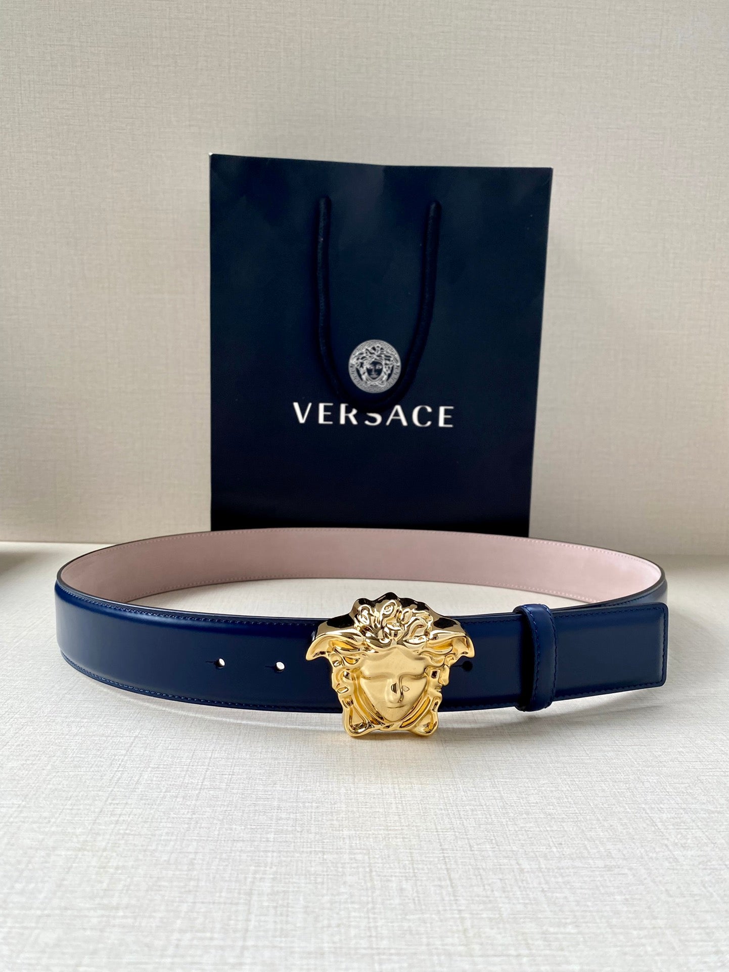 Versace leather belt with gold Medusa buckle, dark blue strap