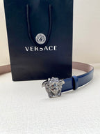 Blue leather belt with silver lion-head buckle, adjustable holes