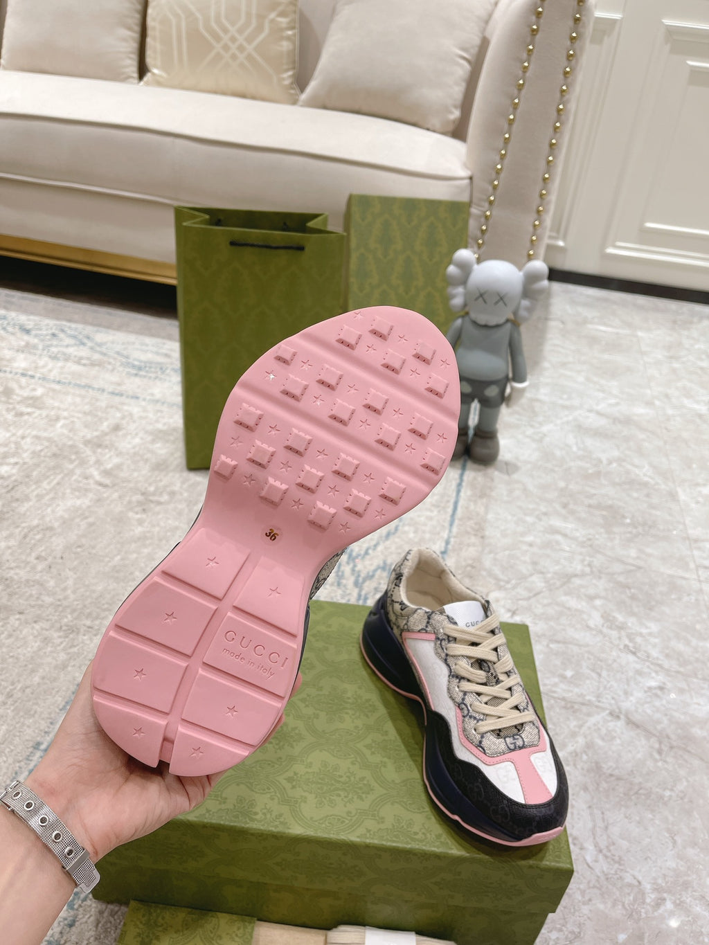 Gucci unisex sneaker outsole, pink tread with brand mark on rubber bottom.