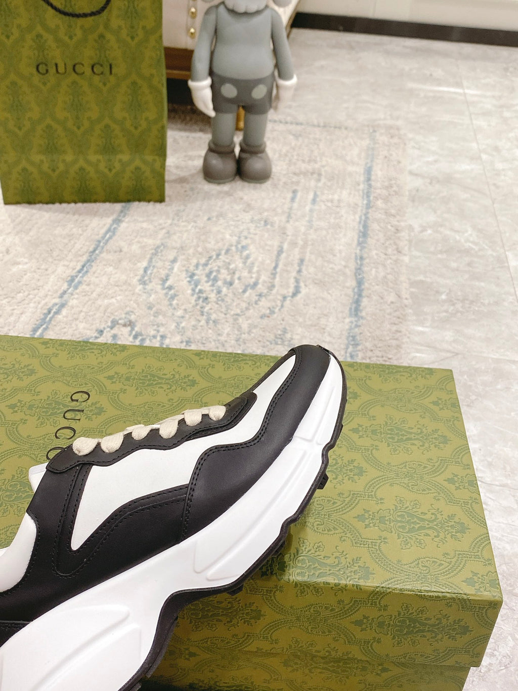 Unisex sneakers, black and white design with cream laces and bold sole