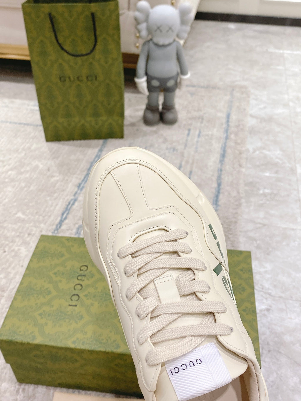Gucci unisex sneakers, white leather, side close-up of lace-up and stitching