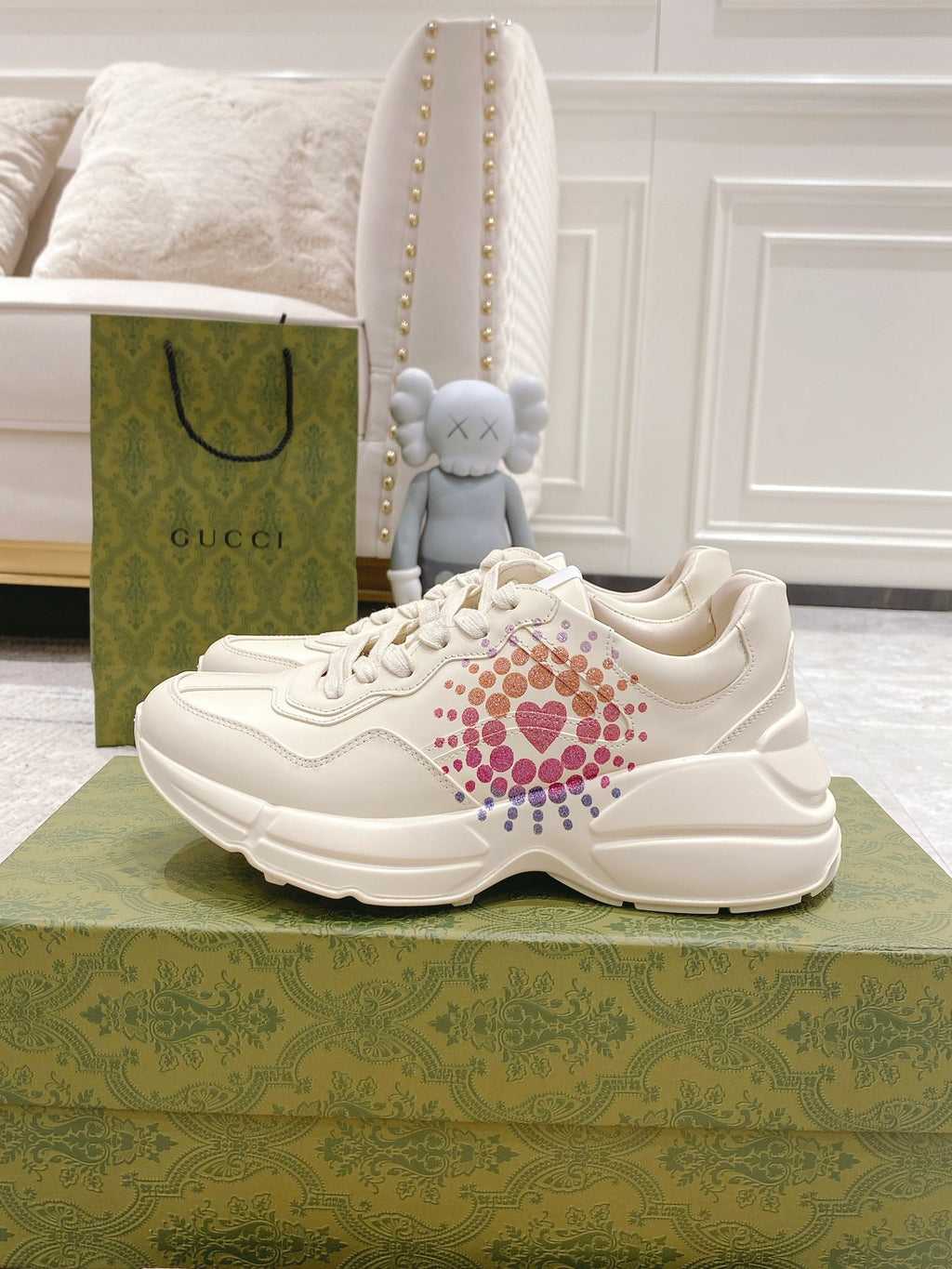 White Gucci unisex sneakers with colorful heart stud logo on the side