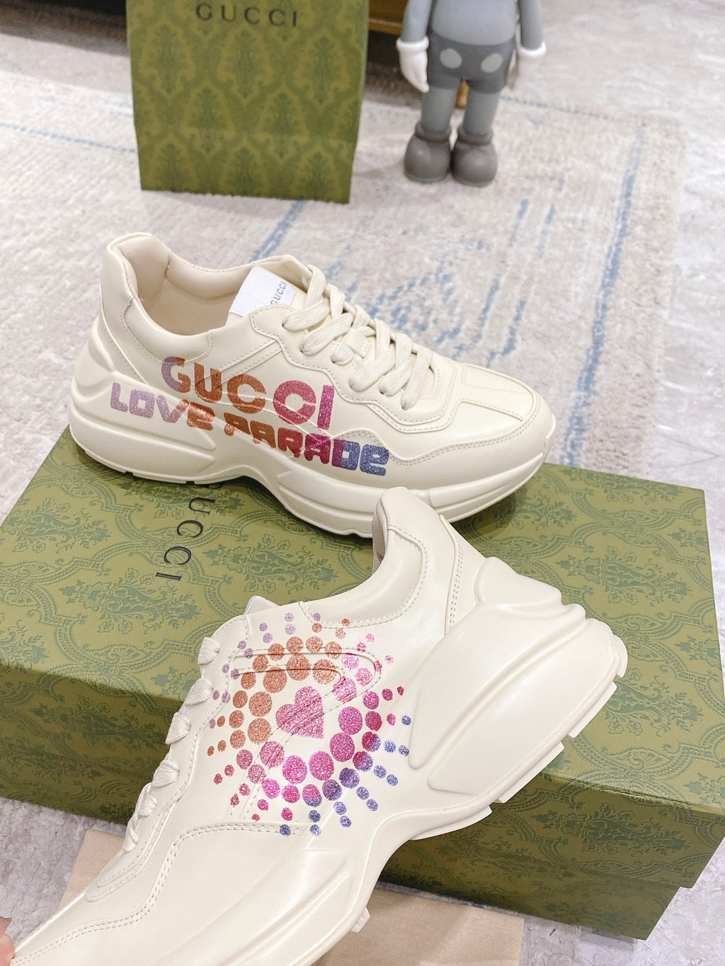 White Gucci unisex sneakers with LOVE PARADE logo across the side panel