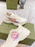 White Gucci unisex sneakers with LOVE PARADE logo across the side panel