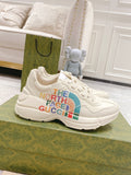 White lace-up sneakers with multicolor The North Face Gucci logo on side