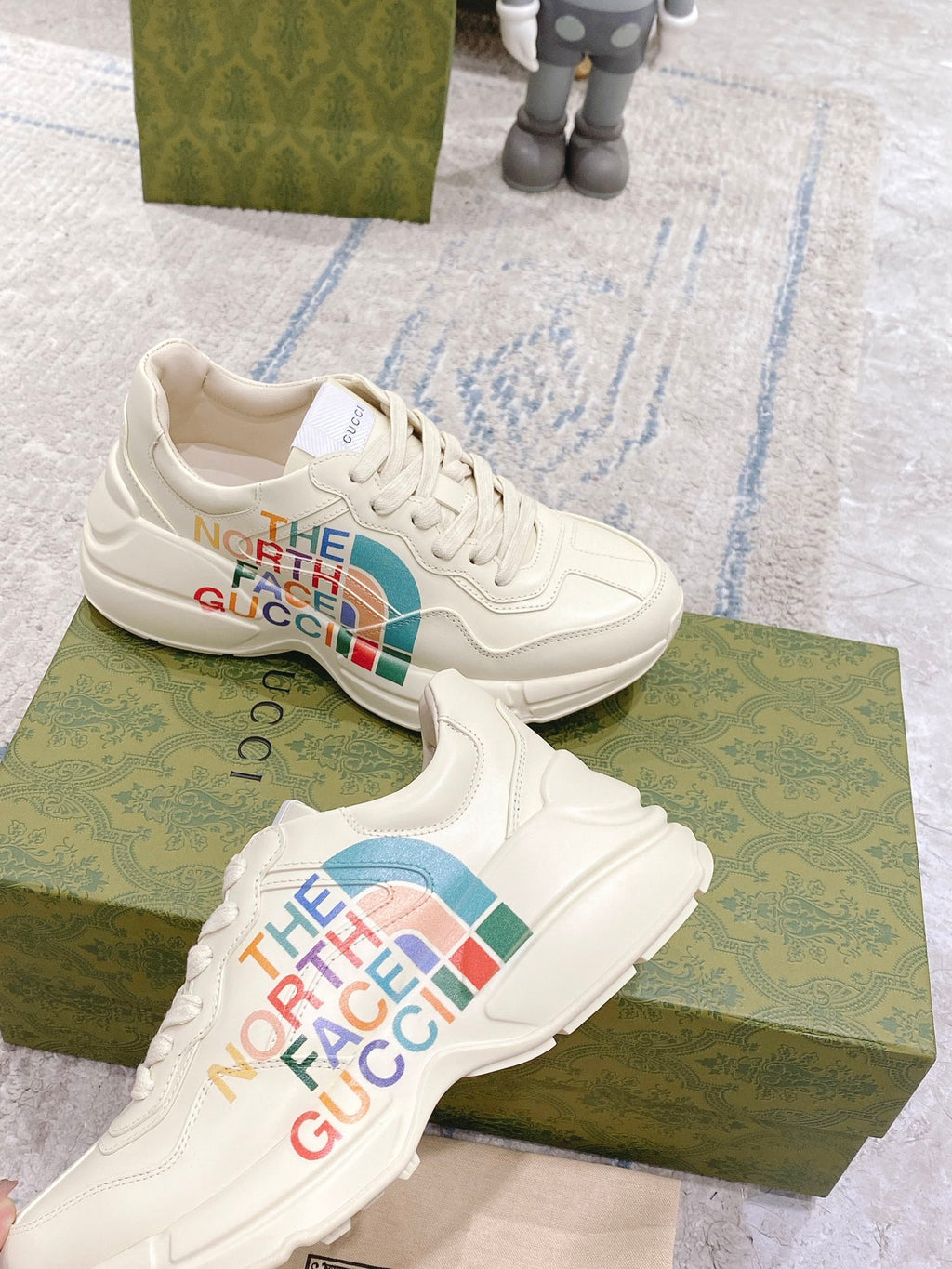 White lace-up sneakers with The North Face Gucci multicolor logos on sides