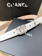 White leather belt with silver-toned CC buckle and rhinestone edge