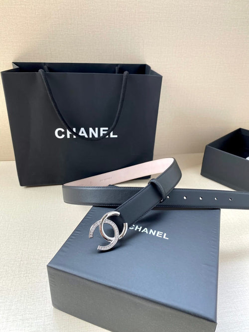 Chanel leather belt with dark blue strap and silver CC buckle on display box